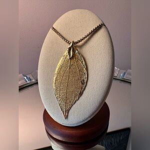 Gold Leaf Pendant on a 24” Gold Tone Box Chain Necklace.